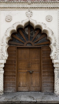 A beautifully crafted wooden door with intricate details.