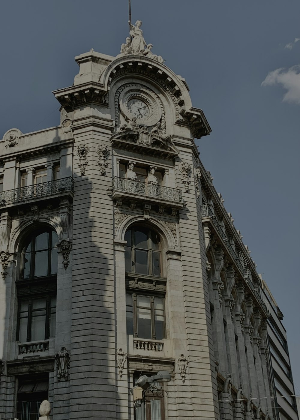 a tall building with a clock on the top of it