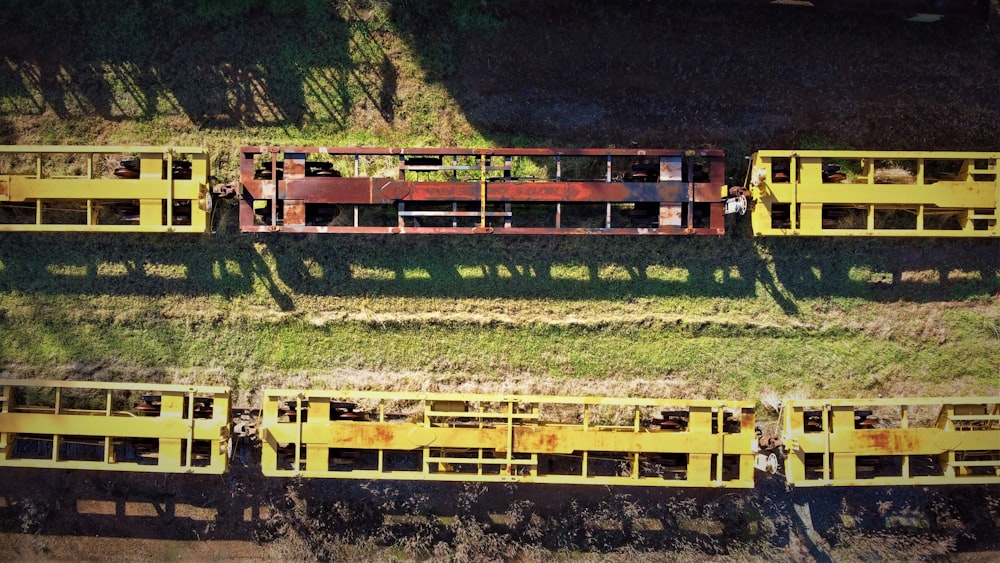 a group of yellow train cars sitting next to each other