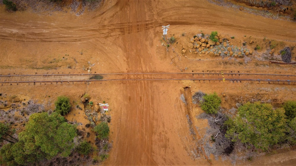 an aerial view of a dirt road in the middle of nowhere