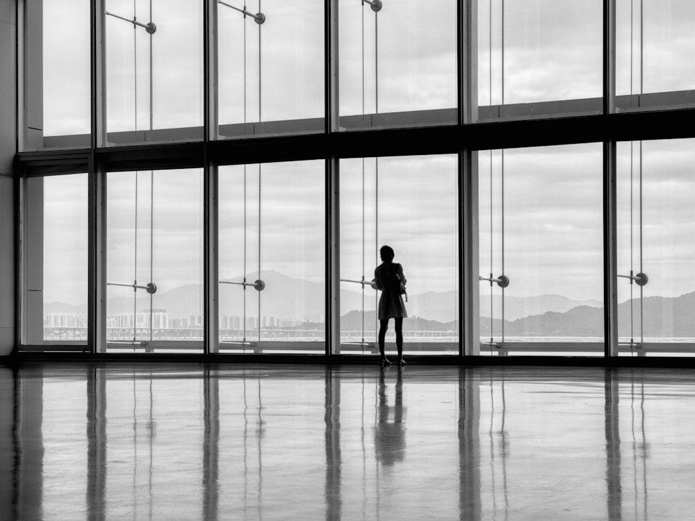 a person standing in front of a large window