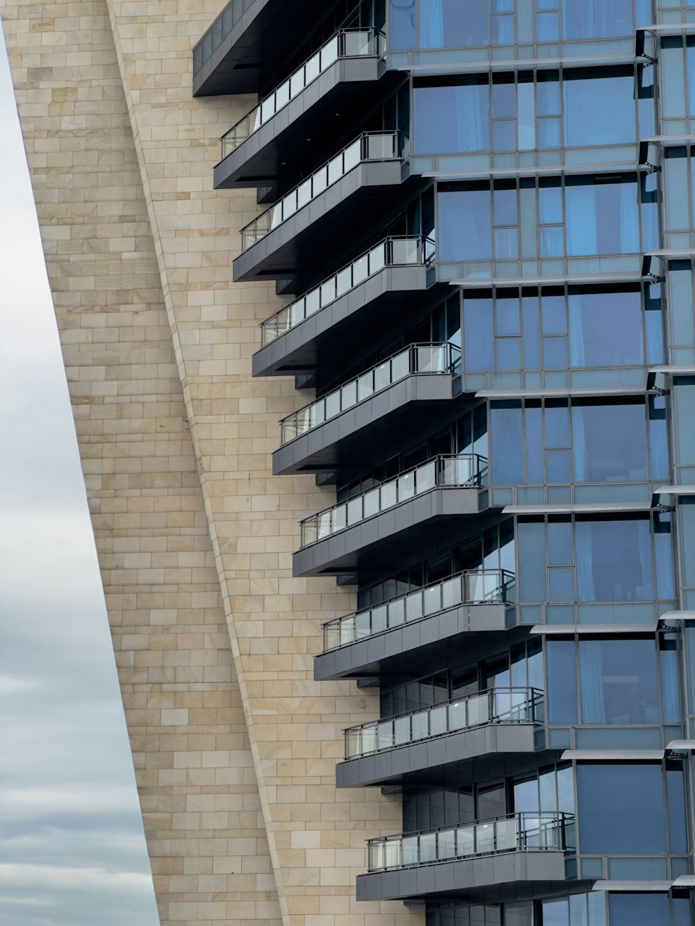 a very tall building with many windows and balconies