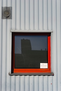 a window with a sign on the side of it