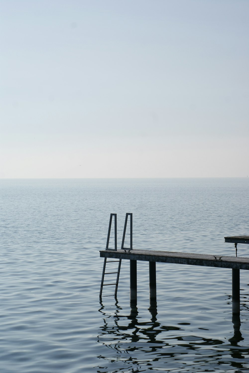 a dock in the middle of a body of water