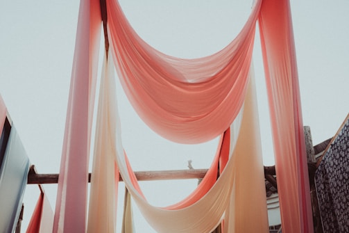 A serene setting with scarves flowing gently in the breeze.
