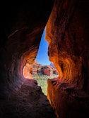 a view of a canyon from inside a cave