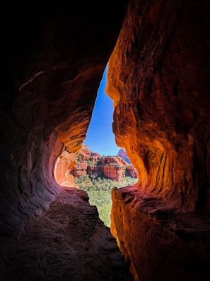 a view of a canyon from inside a cave