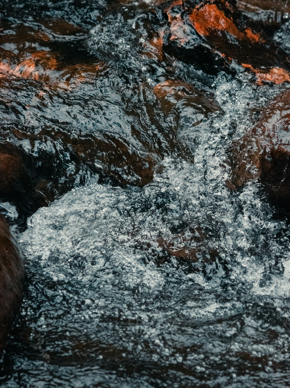 a close up of water with rocks in it