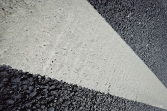 Close-up of pavement markings including directional arrows.