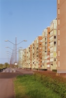 A wide-angle shot of multiple rental units lined up under a bright sky in a northern England business estate.