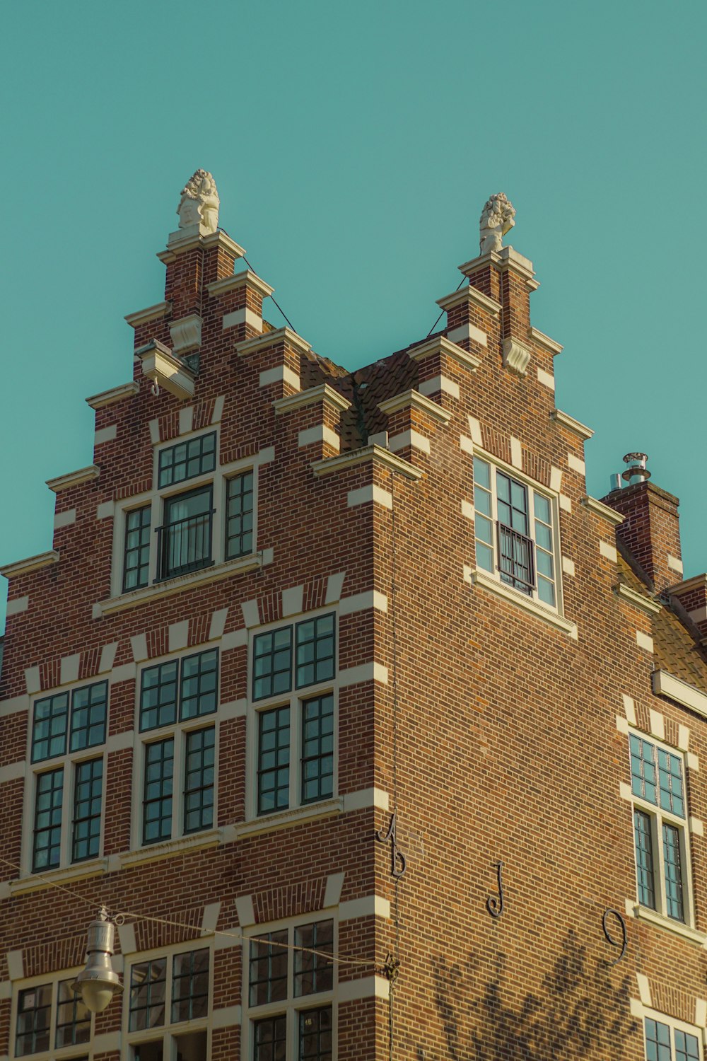 a large brick building with a clock on the front of it