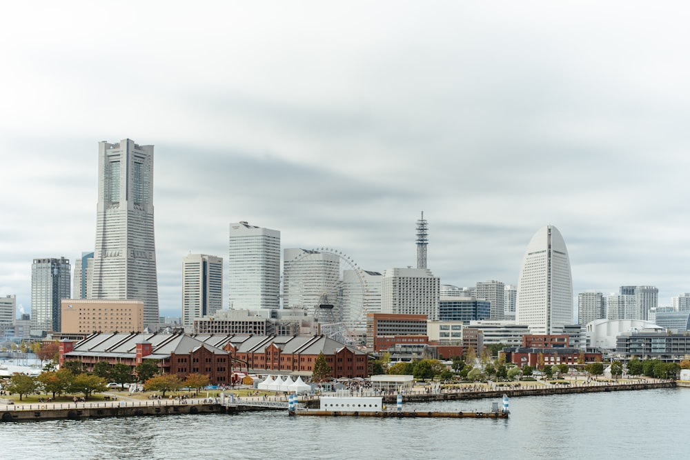 a large body of water with a city in the background