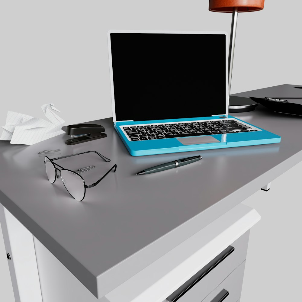 a laptop computer sitting on top of a desk