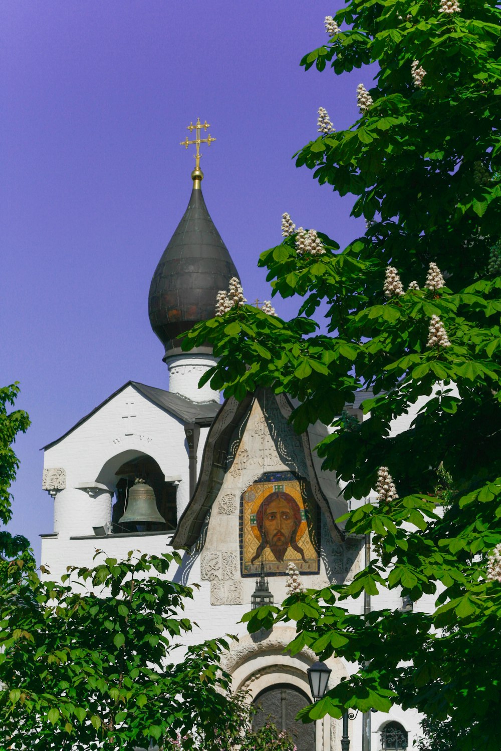 a church with a painting of a lion on the side of it