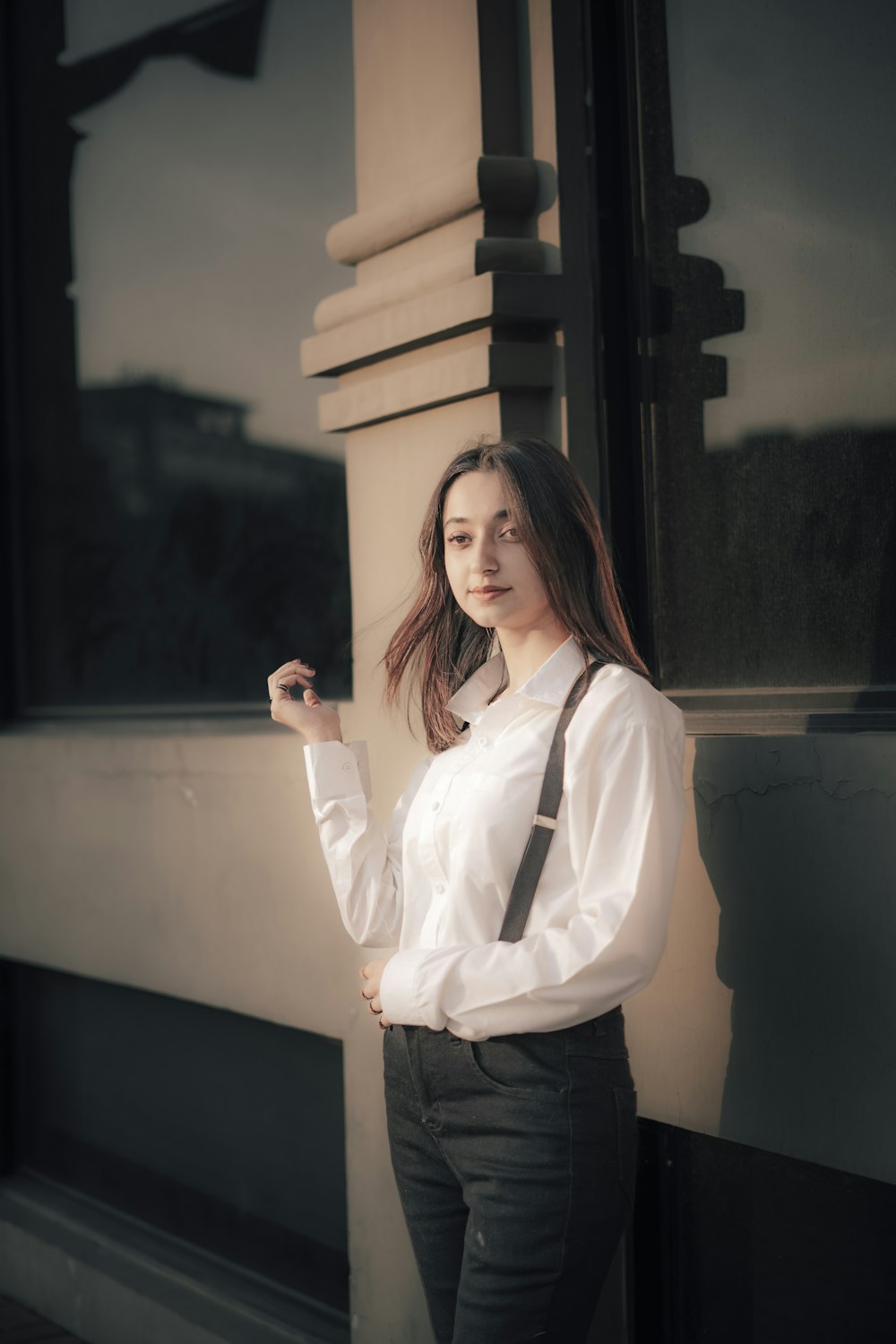 a woman in a white shirt and black tie
