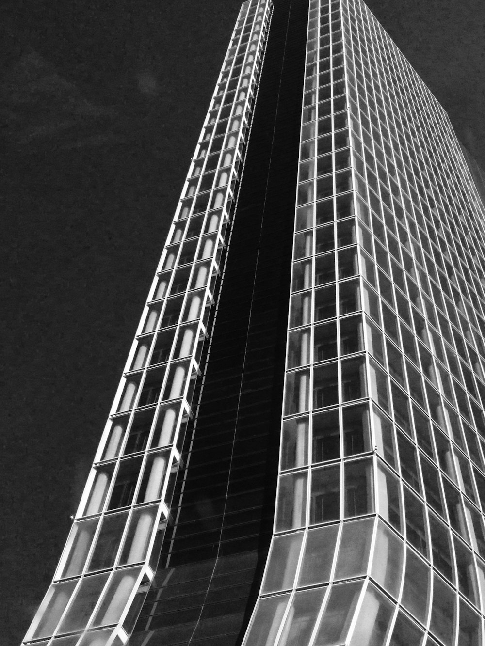 a black and white photo of a tall building