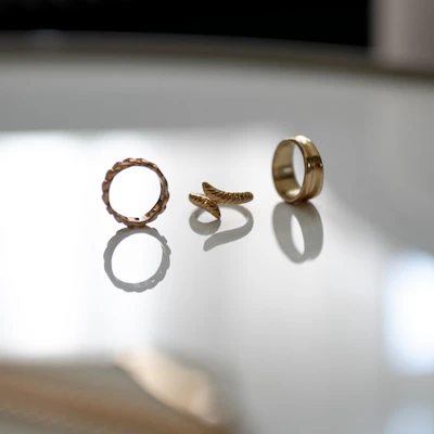 Elegant gold rings stacked together showcasing different textures and finishes