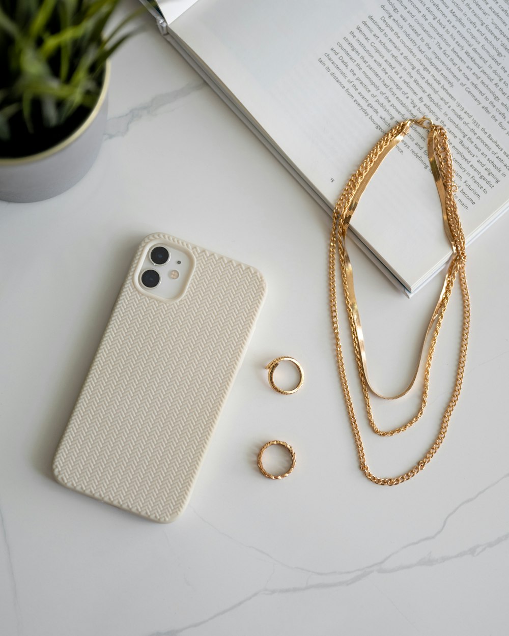 a cell phone and a ring on a table