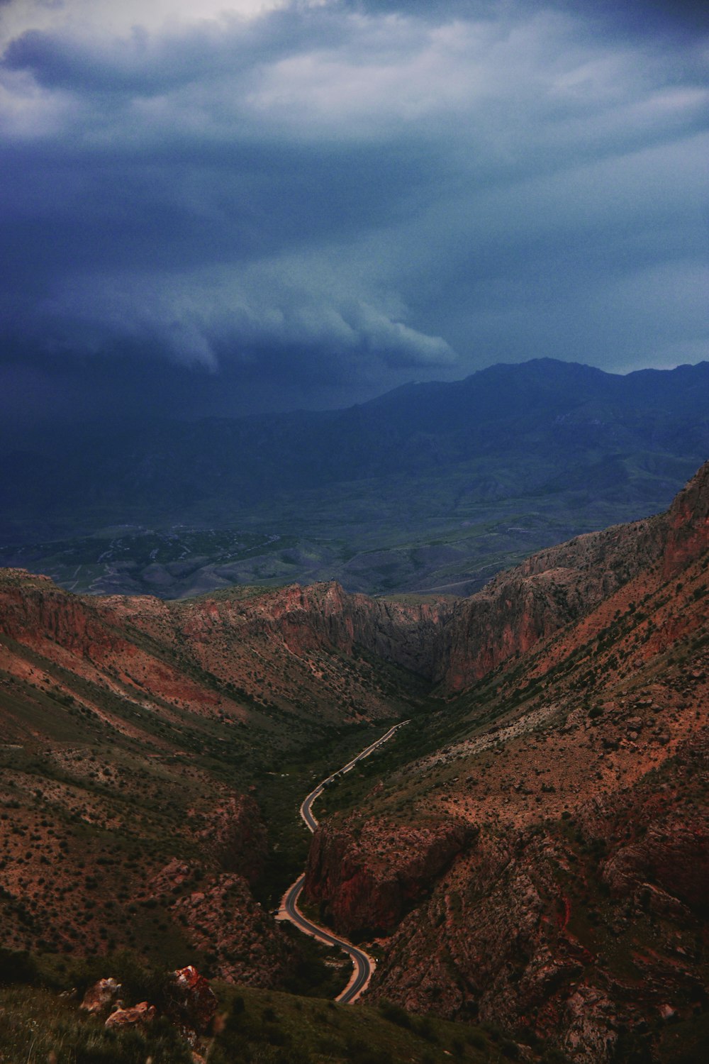 a view of a winding road in the mountains