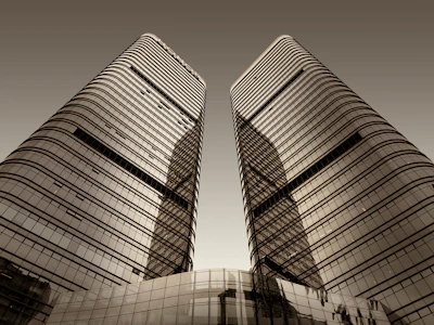 a couple of tall buildings sitting next to each other