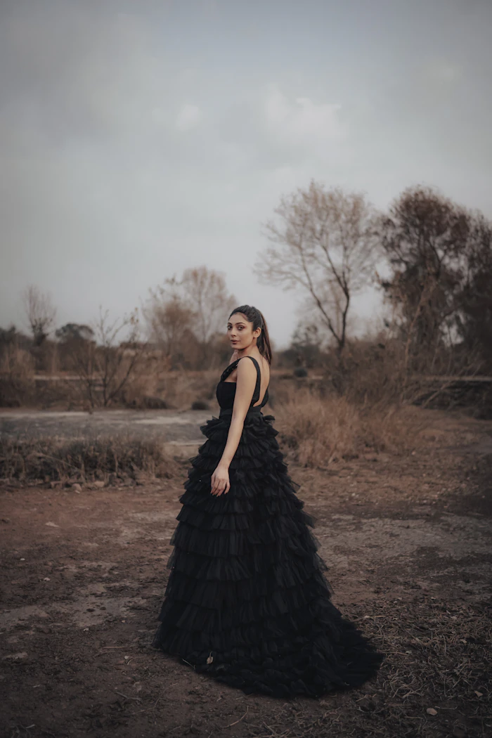 Illustrative stock portrait — Pakistani woman in black dress