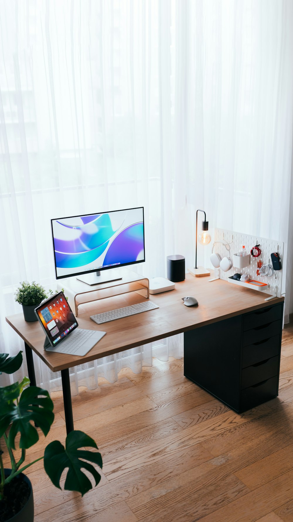 a wooden desk with a computer on top of it