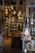 An indoor shop showcasing a variety of traditional and cultural items with intricate designs. The shelves are filled with decorative trinkets, including hanging ornaments, pottery, and figurines. The space is densely packed with colorful goods, creating a vibrant and eclectic atmosphere.