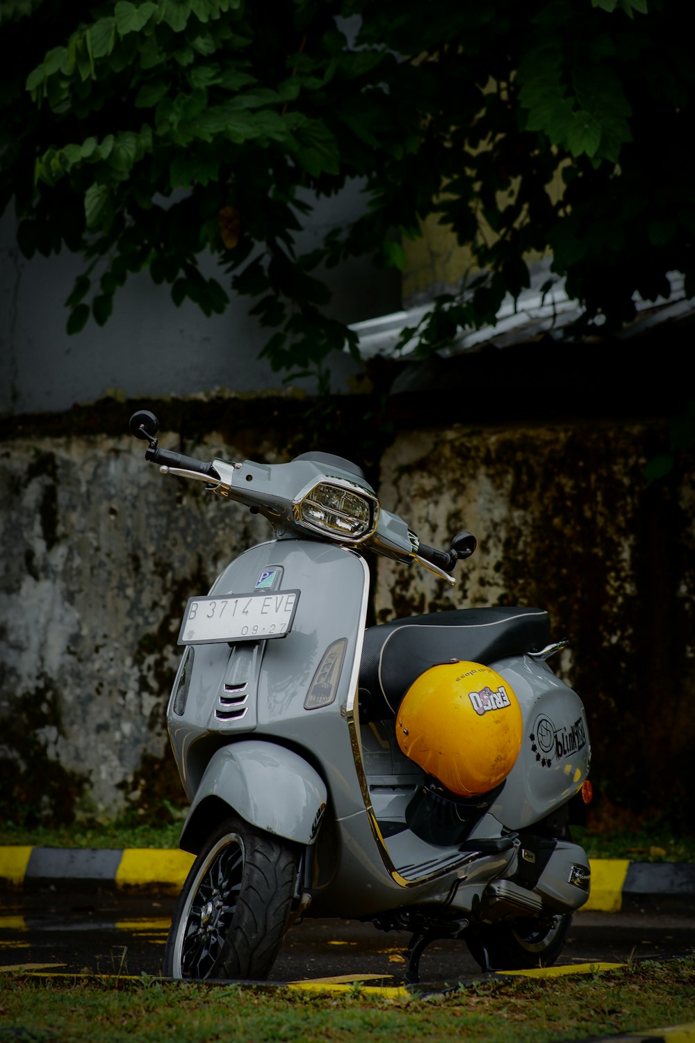 a motor scooter parked on the side of the road