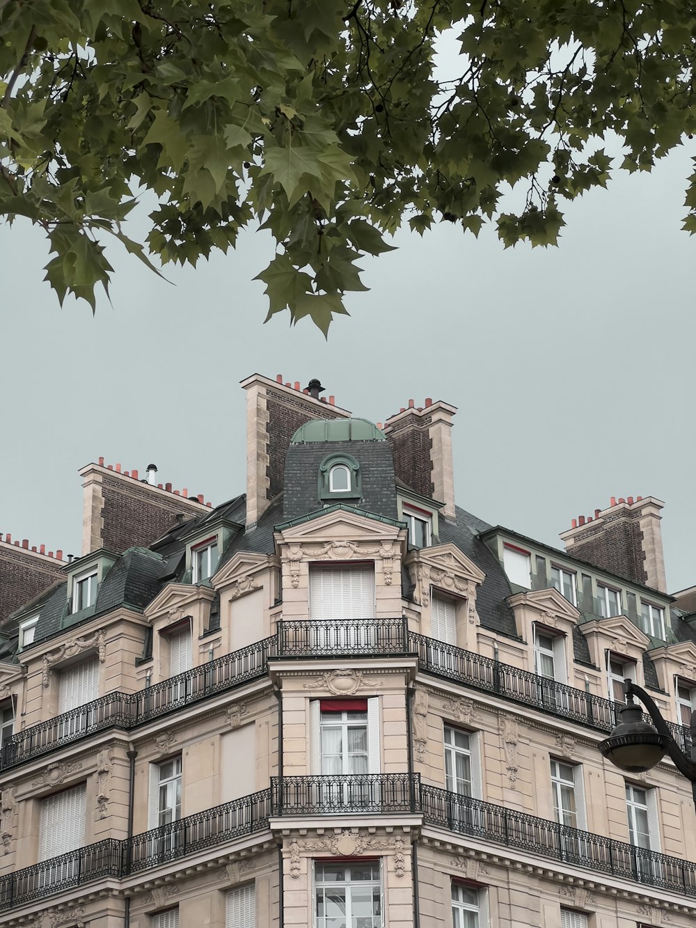 a tall building with many windows and balconies