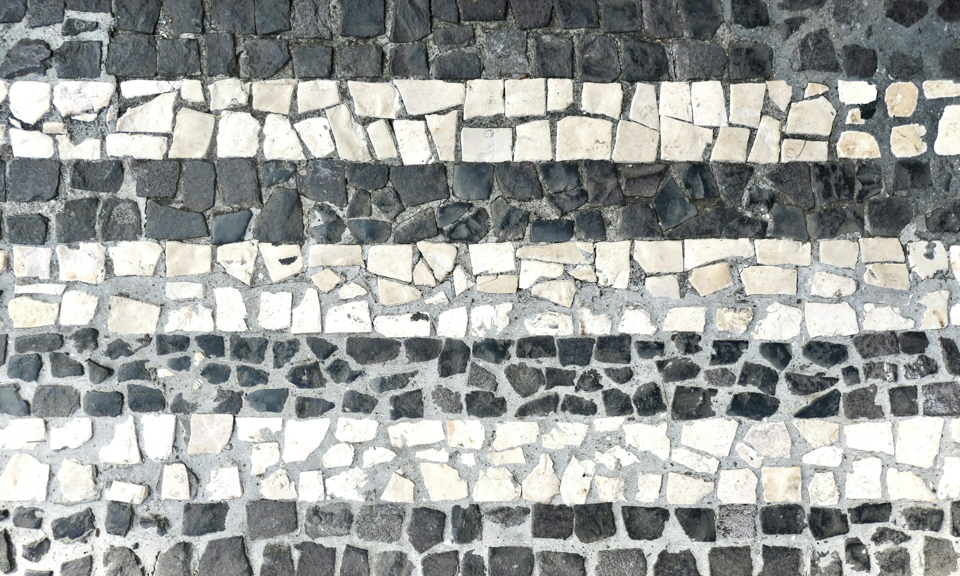 a close up of a stone floor with a white stripe