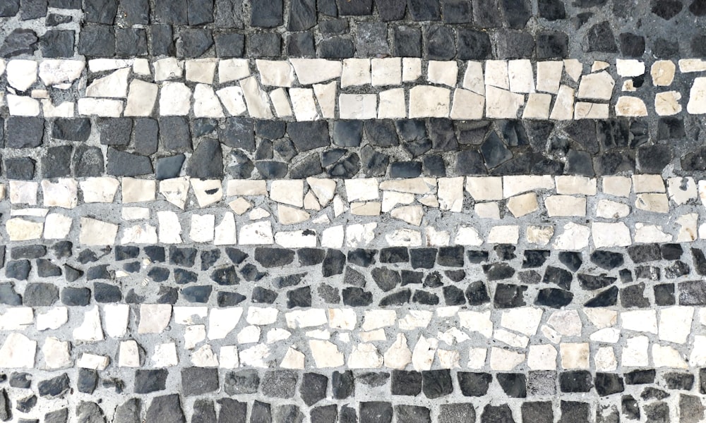 a close up of a stone floor with a white stripe