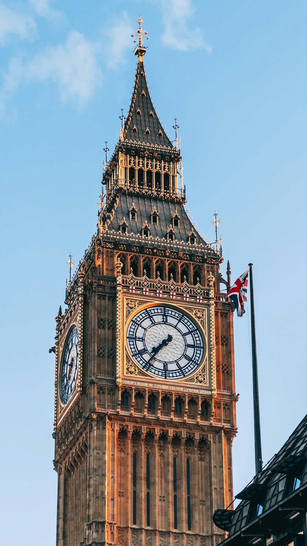 a large clock tower with a sky background