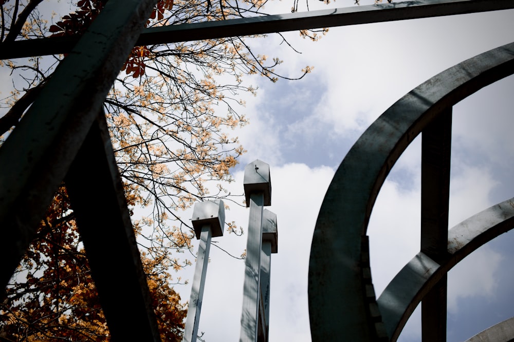 a metal gate with a street light in the background