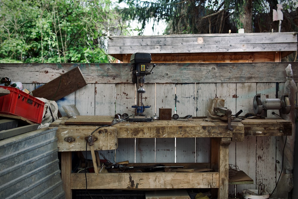 a wooden workbench with tools and tools on it
