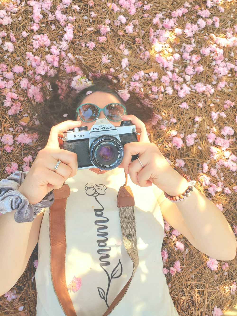 a woman taking a picture of herself with a camera