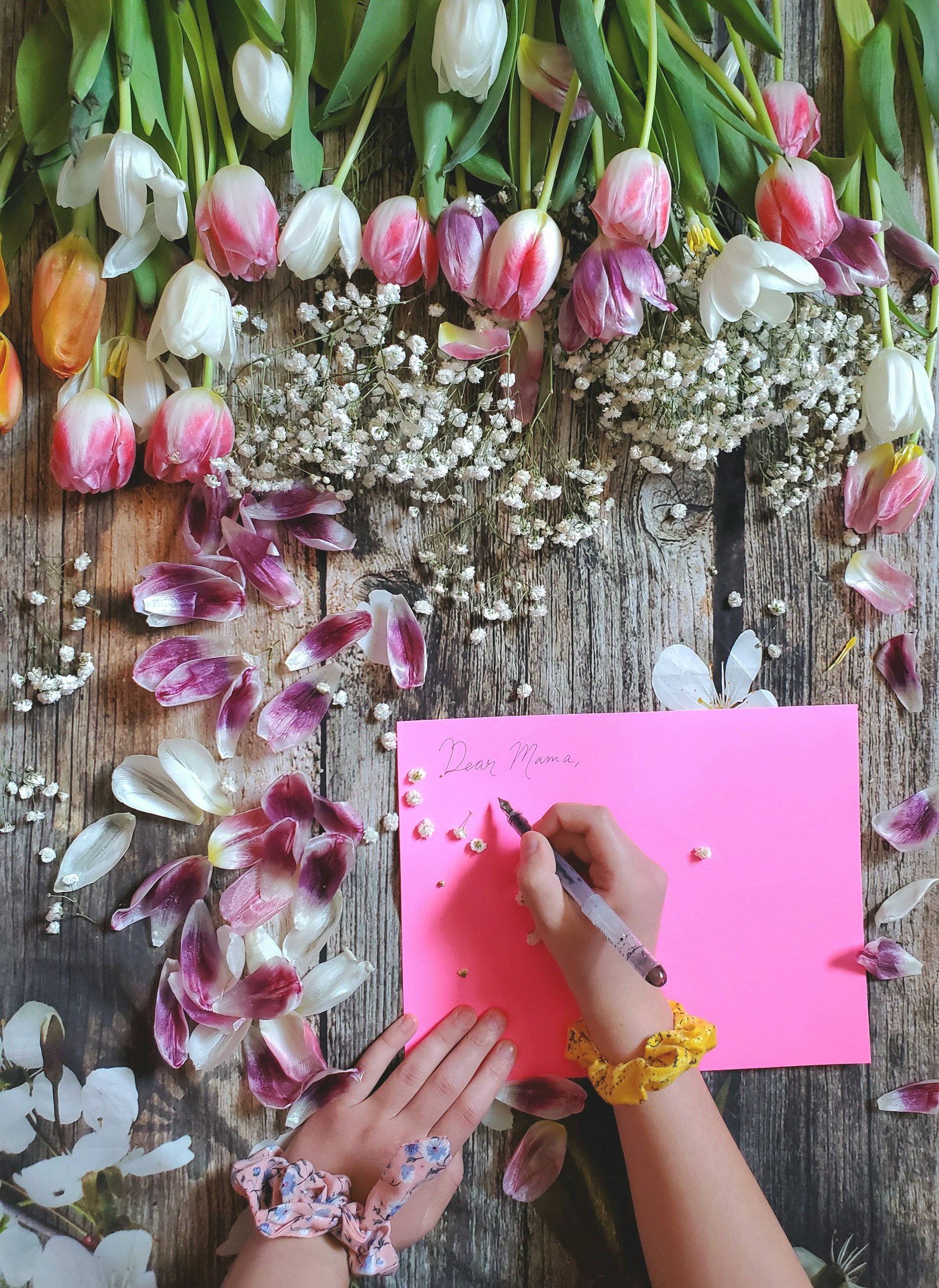 woman wearing yellow long-sleeved dress under white clouds and blue sky during daytime