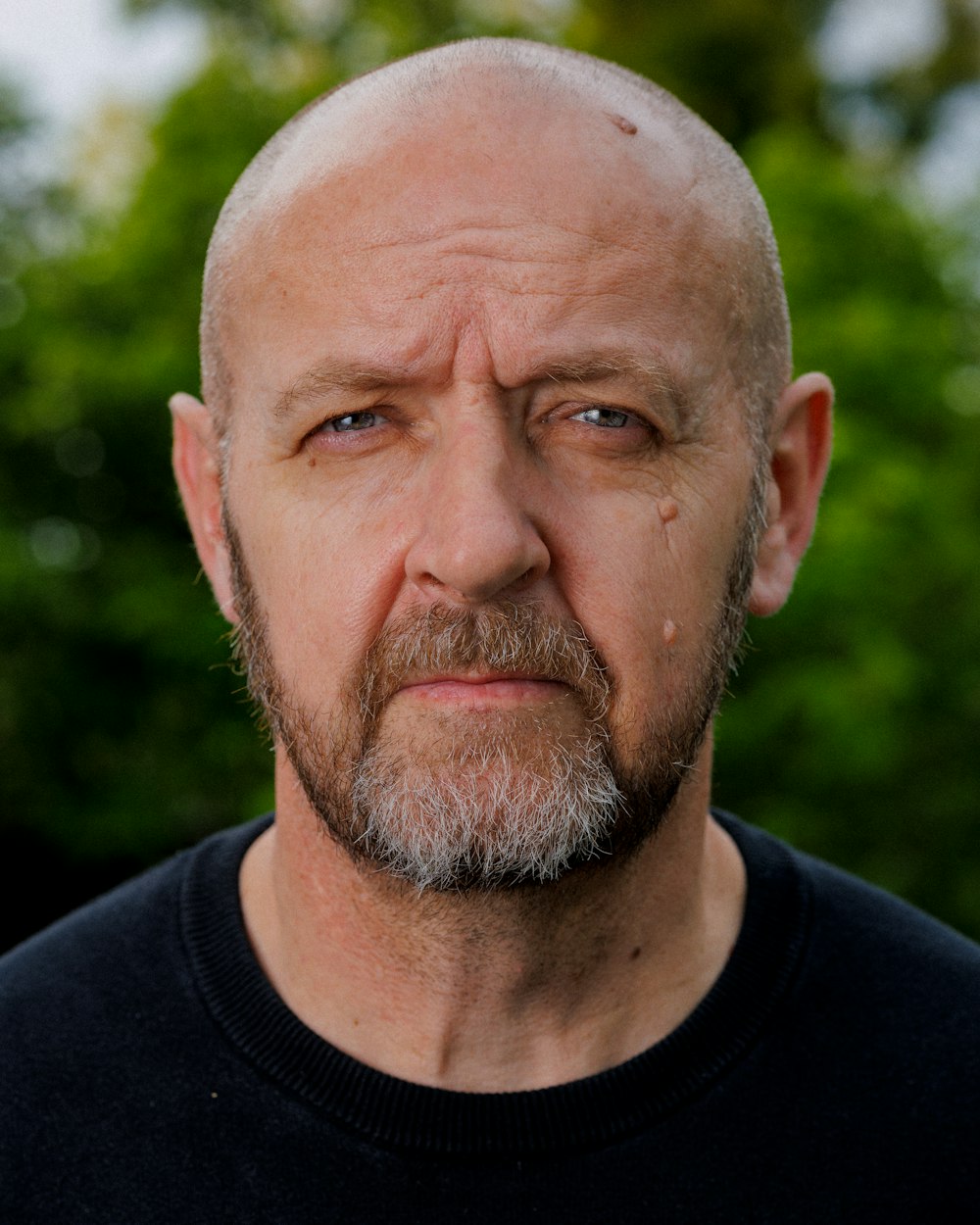 a close up of a person wearing a black shirt