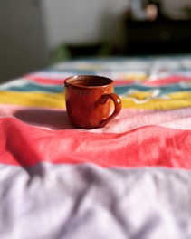 A close-up of colorful cupping set on a plush surface.