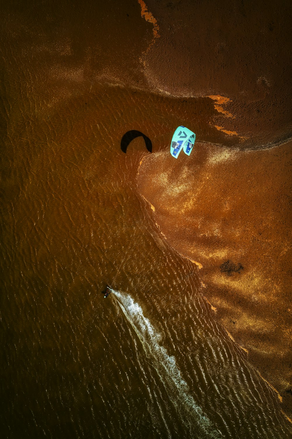 a kite flying over a body of water