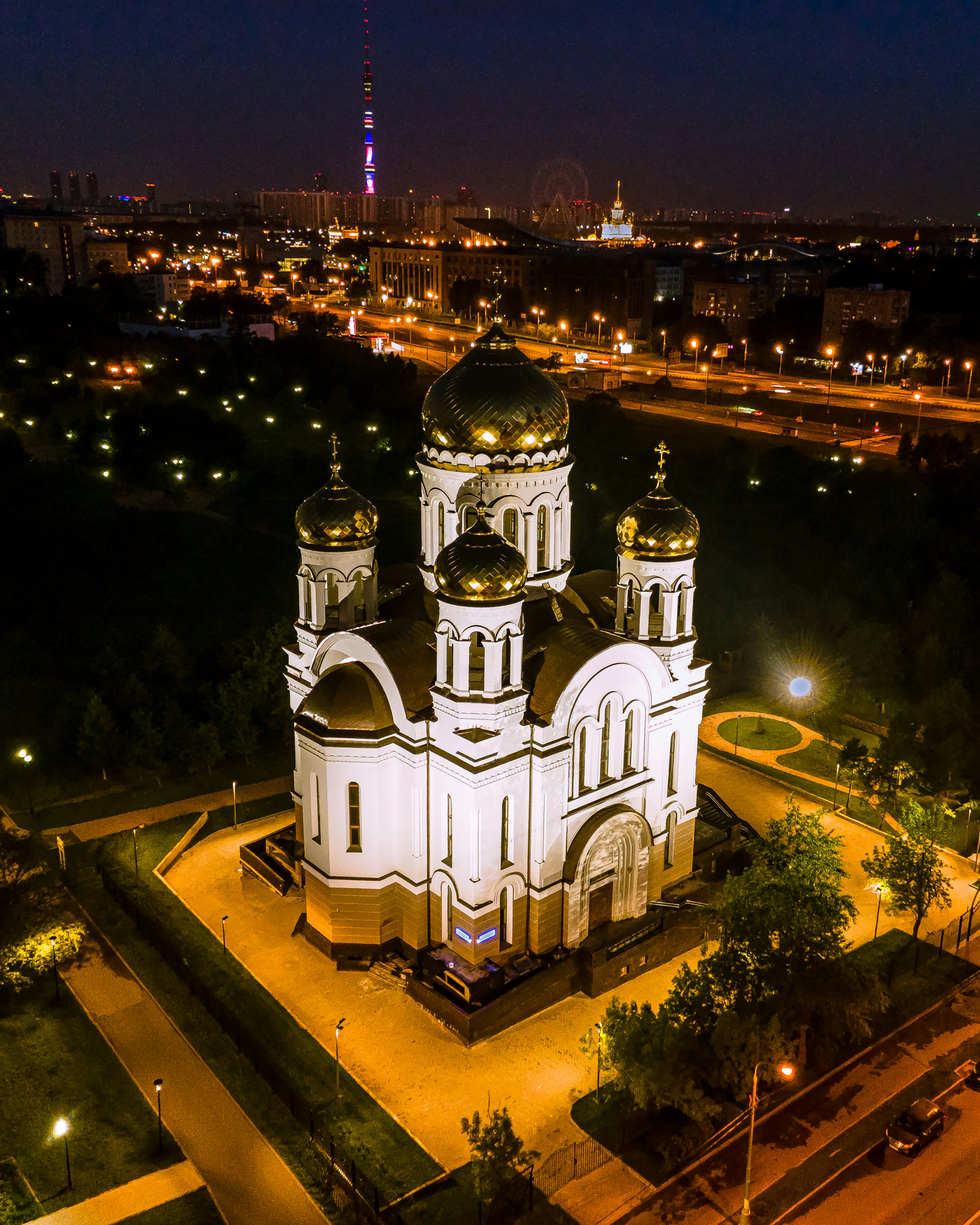 an aerial view of a church at night