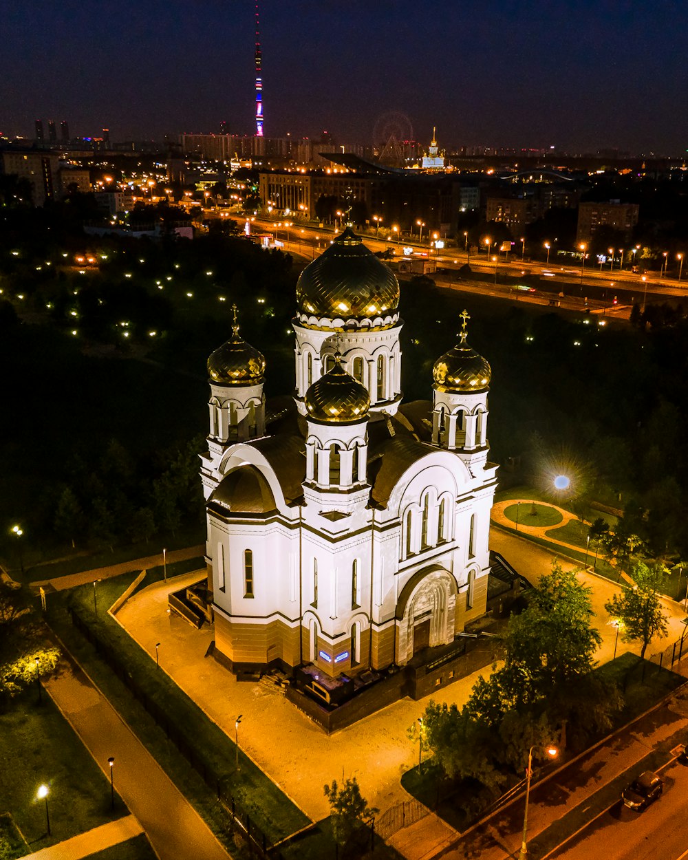 an aerial view of a church at night
