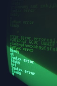 Close-up of a computer screen showing Aspel software interface with error messages.