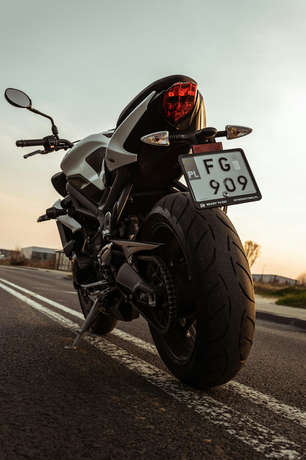 a motorcycle parked on the side of the road