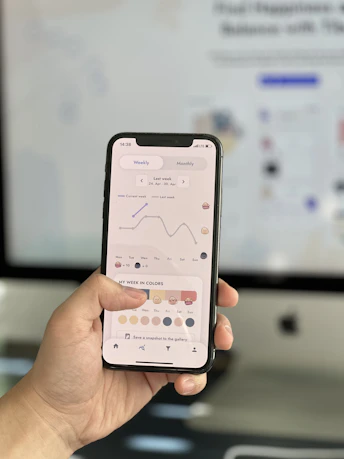 A friendly professional helping a client plan their schedule with a smartphone in hand