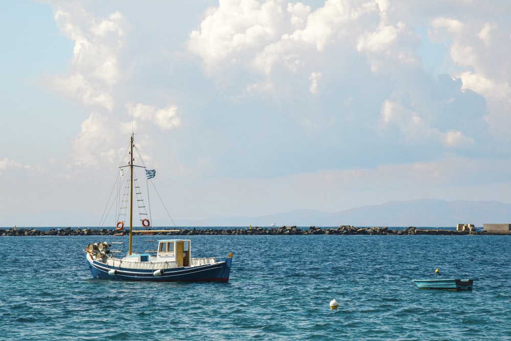 a boat floating on top of a large body of water