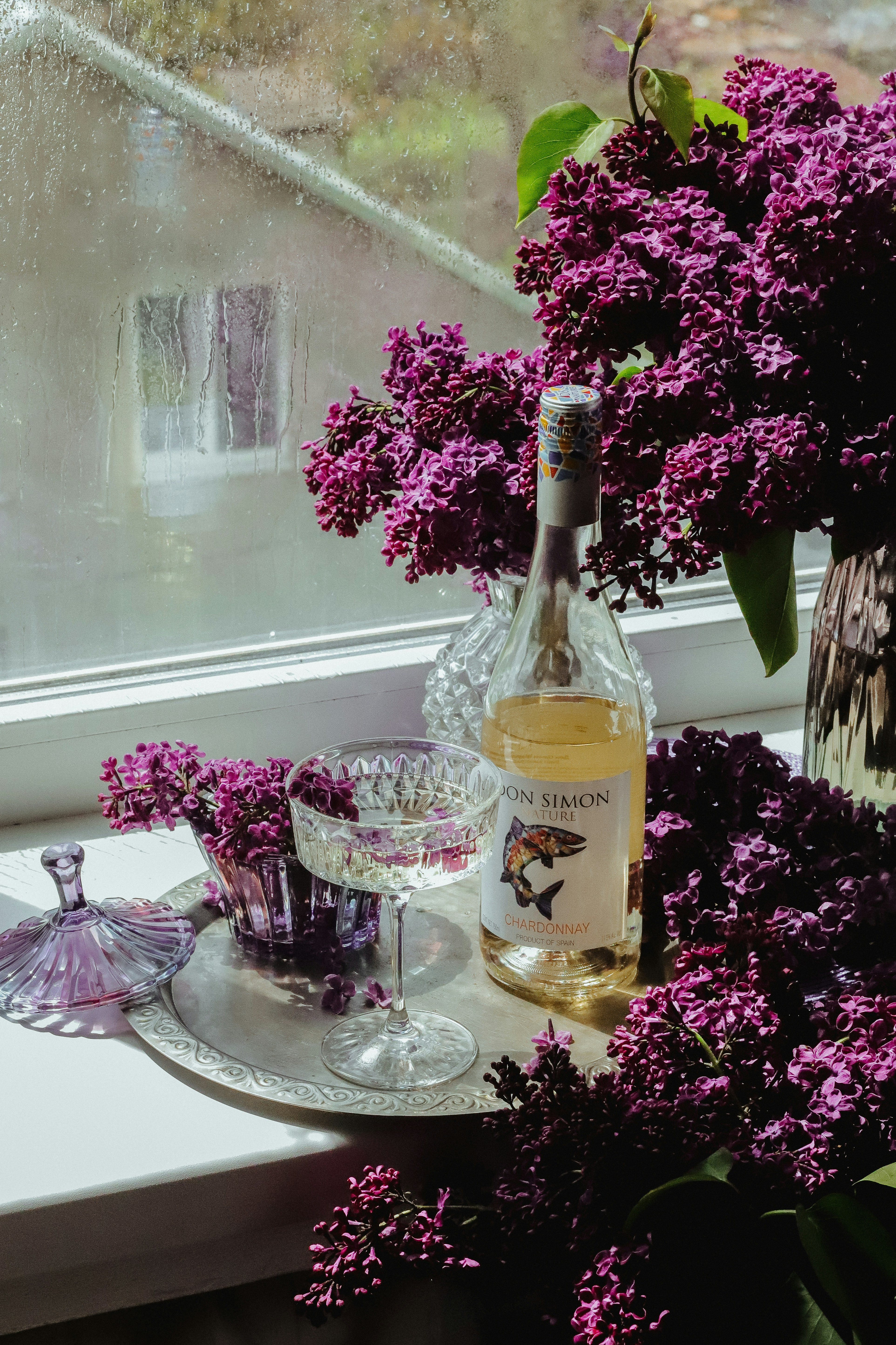 a bottle of wine sitting on top of a tray