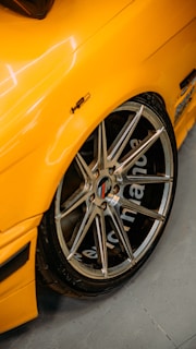 Side view of a sports car on a dynamometer showing horsepower improvement.