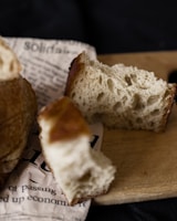 Close-up of artisanal bread and baked goods on a wooden table