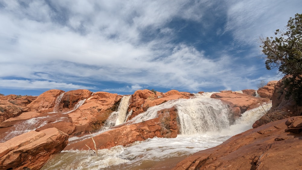 a view of a waterfall from the side of a mountain