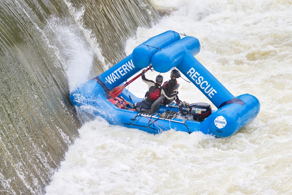 a man riding a raft down a river